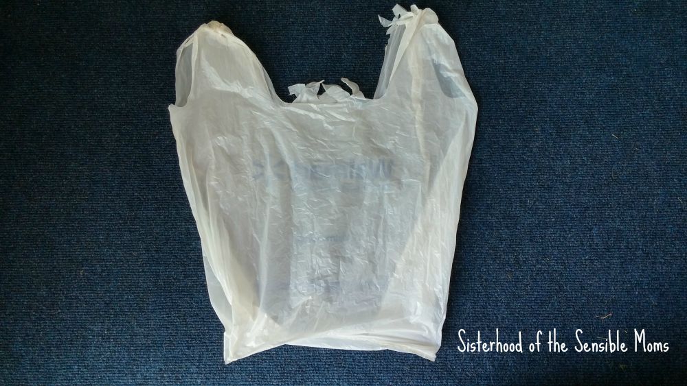 How to fold plastic grocery bags to reduce your clutter. | Clean and Organized | Great tip for packing and travel! Sisterhood of the Sensible Moms